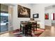Cozy dining room with seating for six and sliding doors to the outdoors at 1725 E Chanute Pass --, Phoenix, AZ 85040