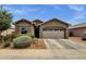 Charming single-story home featuring a well-manicured yard and a spacious two-car garage at 1725 E Chanute Pass --, Phoenix, AZ 85040