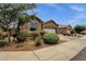 Well-maintained home showing landscaped front yard and driveway, offering curb appeal at 1725 E Chanute Pass --, Phoenix, AZ 85040