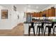 Bright kitchen with stainless steel appliances, wood cabinets, black countertops, and bar seating at 1725 E Chanute Pass --, Phoenix, AZ 85040
