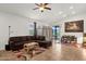 Spacious living room with tile floors, ceiling fan, ample light, and modern furnishings at 1725 E Chanute Pass --, Phoenix, AZ 85040