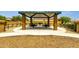 Picnic tables and grills under a covered area, ideal for community gatherings and outdoor dining at 1725 E Chanute Pass --, Phoenix, AZ 85040