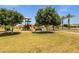 Another view of the playground within the community, with playground, benches, and trees at 1725 E Chanute Pass --, Phoenix, AZ 85040