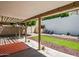 A covered patio featuring desert landscaping, rock and artificial turf at 18031 N 12Th Pl, Phoenix, AZ 85022