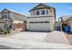 Contemporary home exterior featuring a large driveway and attached garage at 18031 N 12Th Pl, Phoenix, AZ 85022