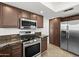 Kitchen featuring stainless steel appliances and granite countertops at 18031 N 12Th Pl, Phoenix, AZ 85022