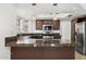 Well-lit kitchen with stainless steel appliances and granite countertops at 18031 N 12Th Pl, Phoenix, AZ 85022