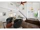 Bright living room featuring hardwood floors, a soaring ceiling, and staircase at 18031 N 12Th Pl, Phoenix, AZ 85022