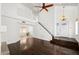 Spacious living room featuring hardwood floors, staircase, and a contemporary design at 18031 N 12Th Pl, Phoenix, AZ 85022