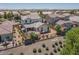 Aerial view of the backyard with a patio, fence, and lush greenery at 18309 N Crestview Ln, Maricopa, AZ 85138