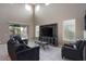 Spacious living room features tile flooring and large windows for natural light at 18309 N Crestview Ln, Maricopa, AZ 85138
