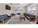 Cozy living room featuring fireplace, comfortable seating, and decorative rug at 18309 N Crestview Ln, Maricopa, AZ 85138