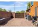 Low maintenance backyard with gravel and brick fence at 18649 W Williams St, Goodyear, AZ 85338