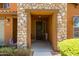Inviting entryway with a decorative wreath and a welcome sign, creating a warm ambiance at 18649 W Williams St, Goodyear, AZ 85338