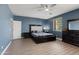 Main bedroom with stylish decor, neutral walls and floors, and a comfortable bed at 18649 W Williams St, Goodyear, AZ 85338