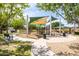 Community playground featuring climbing structures, sun shades, and recreational areas at 18649 W Williams St, Goodyear, AZ 85338