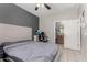 Comfortable bedroom featuring a large bed and access to the ensuite bathroom at 19342 W Morning Glory Dr, Buckeye, AZ 85326