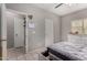 Bright bedroom with tile floors, neutral colors, and ample closet space at 19342 W Morning Glory Dr, Buckeye, AZ 85326