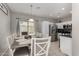 Dining area featuring stylish pendant lighting and sliding glass doors to the backyard at 19342 W Morning Glory Dr, Buckeye, AZ 85326