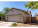 Side view of the house showing a garage, tile roof, and neutral stucco at 19342 W Morning Glory Dr, Buckeye, AZ 85326