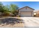 Charming single-story home featuring a two-car garage and low maintenance front yard at 19342 W Morning Glory Dr, Buckeye, AZ 85326