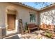 Inviting front porch with charming décor, seating, and a covered entrance at 19342 W Morning Glory Dr, Buckeye, AZ 85326