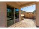 Covered patio with brick pavers, an outdoor table, and string lights, perfect for evening relaxation at 19342 W Morning Glory Dr, Buckeye, AZ 85326
