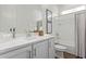 Clean, well-lit bathroom with white cabinets, shower-tub combination, and neutral decor at 1951 W Plum Rd, Phoenix, AZ 85085