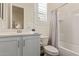 Well-lit bathroom with a shower-tub combination and vanity with storage underneath at 1951 W Plum Rd, Phoenix, AZ 85085