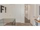 Neutral bedroom with closet, showing open doorway to hall and decorated with 'F!' on the wall at 1951 W Plum Rd, Phoenix, AZ 85085