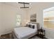 Modern bedroom with a large window with shutters, and stylish decor throughout at 1951 W Plum Rd, Phoenix, AZ 85085