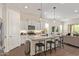 Modern kitchen with granite countertops, stainless steel appliances, and an island with seating at 1951 W Plum Rd, Phoenix, AZ 85085