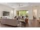 Spacious living room with tile floors, modern sofas, and a large sliding glass door at 1951 W Plum Rd, Phoenix, AZ 85085