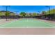 Well-maintained tennis court ready for a competitive match, set against a backdrop of picturesque desert scenery at 1951 W Plum Rd, Phoenix, AZ 85085