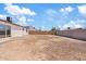 Large, unfurnished backyard with a block wall, offering a blank canvas for landscaping at 2022 N 61St Ave, Phoenix, AZ 85035