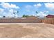 Large, unfurnished backyard with a block wall, offering a blank canvas for landscaping at 2022 N 61St Ave, Phoenix, AZ 85035