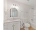 Bathroom features white cabinets, a walk-in shower, and light wood flooring at 2022 N 61St Ave, Phoenix, AZ 85035