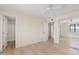 Spacious bedroom with a mirrored closet, adjacent bathroom and neutral color palette at 2022 N 61St Ave, Phoenix, AZ 85035
