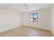 Bright bedroom with a modern window and light wood floors provides ample space at 2022 N 61St Ave, Phoenix, AZ 85035