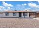 Charming single-story home featuring a covered porch, neutral paint, and low maintenance front yard at 2022 N 61St Ave, Phoenix, AZ 85035