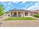 Backyard featuring a covered patio, desert landscaping and block wall at 209 E Diamond Trl, San Tan Valley, AZ 85143