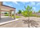 Backyard featuring a covered patio and desert landscaping at 209 E Diamond Trl, San Tan Valley, AZ 85143