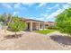 Backyard featuring a covered patio, desert landscaping and block wall at 209 E Diamond Trl, San Tan Valley, AZ 85143