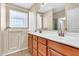 Bathroom showcasing double sinks, white countertops, and a walk-in tub at 209 E Diamond Trl, San Tan Valley, AZ 85143