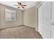 Comfortable bedroom featuring a ceiling fan, closet, and natural light at 209 E Diamond Trl, San Tan Valley, AZ 85143