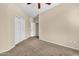 Inviting bedroom featuring a closet, plush carpet, and a view of the hallway at 209 E Diamond Trl, San Tan Valley, AZ 85143