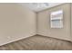 Cozy bedroom with a ceiling fan, natural light, and neutral walls at 209 E Diamond Trl, San Tan Valley, AZ 85143