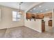 Dining room with tile flooring, modern lighting and access to the kitchen at 209 E Diamond Trl, San Tan Valley, AZ 85143