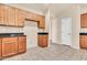 Kitchen featuring neutral tile floor and wood cabinets at 209 E Diamond Trl, San Tan Valley, AZ 85143