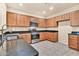 Well-lit kitchen featuring stainless steel appliances and granite countertops at 209 E Diamond Trl, San Tan Valley, AZ 85143
